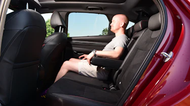 Auto Express chief reviewer Alex Ingram sitting in the back of the Hyundai Tucson
