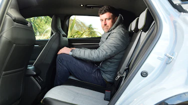 Auto Express group web editor Steve Walker sitting in back seat of Renault Megane E-Tech