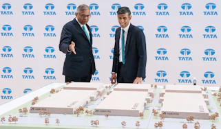 Natarajan Chandrasekaran and Rishi Sunak looking at a model factory