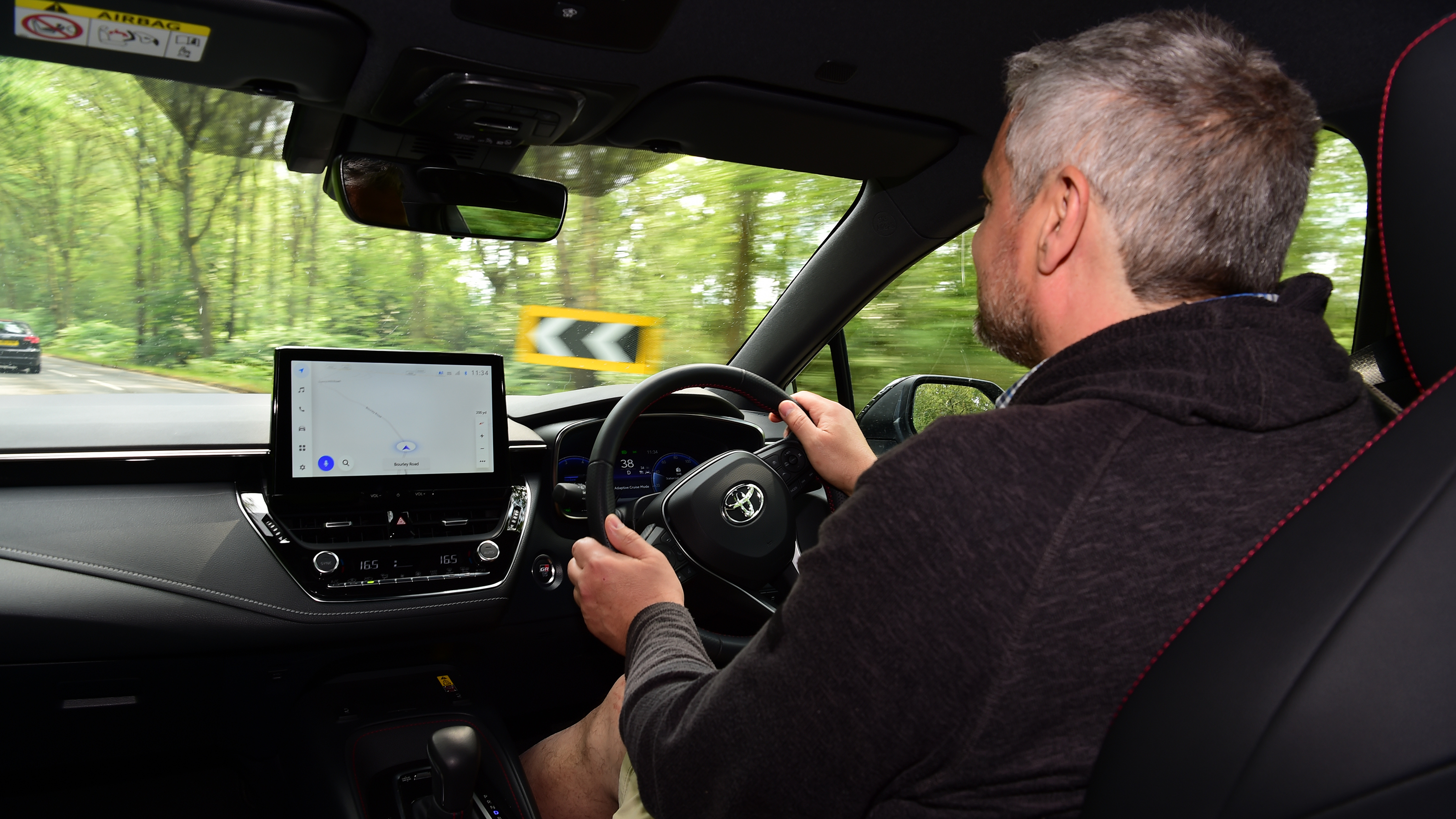 Auto Express current affairs and features editor Chris Rosamond driving the Toyota Corolla
