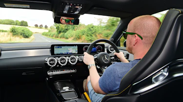 Auto Express chief reviewer Alex Ingram driving the Mercedes-AMG A45 S