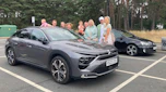 Auto Express creative director Darren Wilson's family standing next to the Citroen C5 X