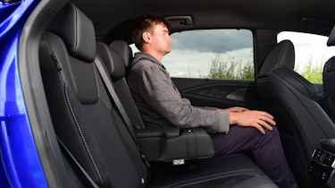 Auto Express senior news reporter Alastair Crooks sitting in back seat of Lexus RX 500h