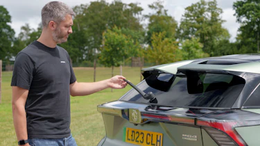 Carbuyer and DrivingElectric editor Richard Ingram inspecting the MG4 XPower's rear wiper