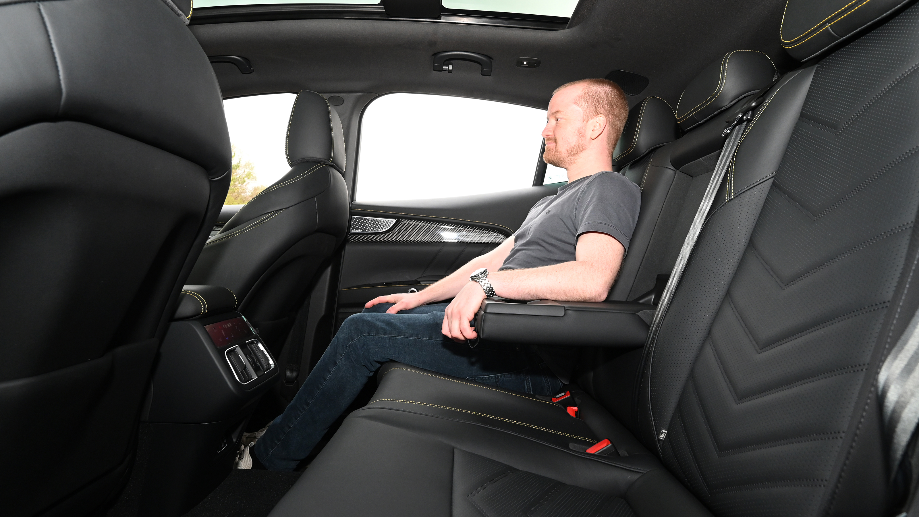 Former Auto Express chief reviewer Alex Ingram sitting in the back seat of the Maserati Grecale