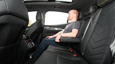 Former Auto Express chief reviewer Alex Ingram sitting in the back seat of the Maserati Grecale