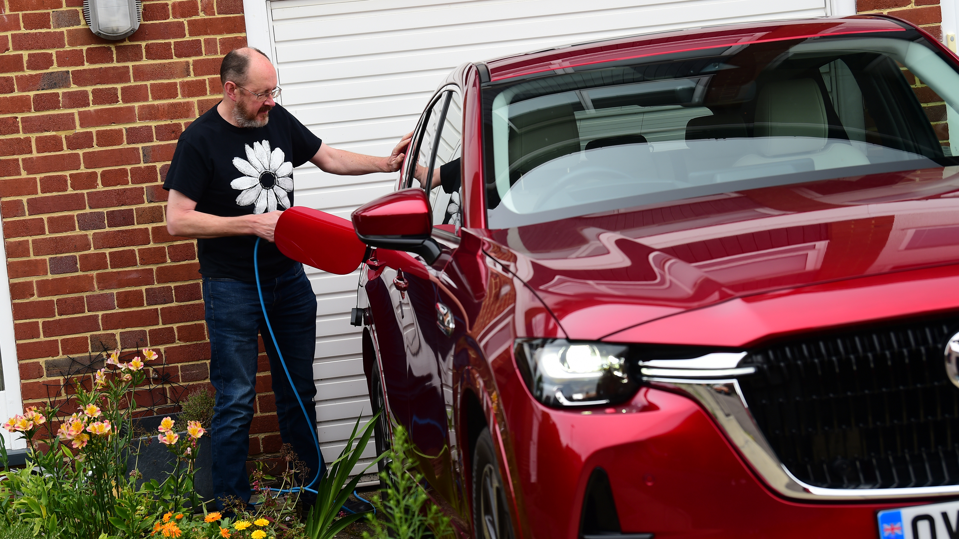 Auto Express chief sub-editor Andy Pringle plugging-in the Mazda CX-60