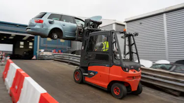 Recycled car parts - car transported by forklift