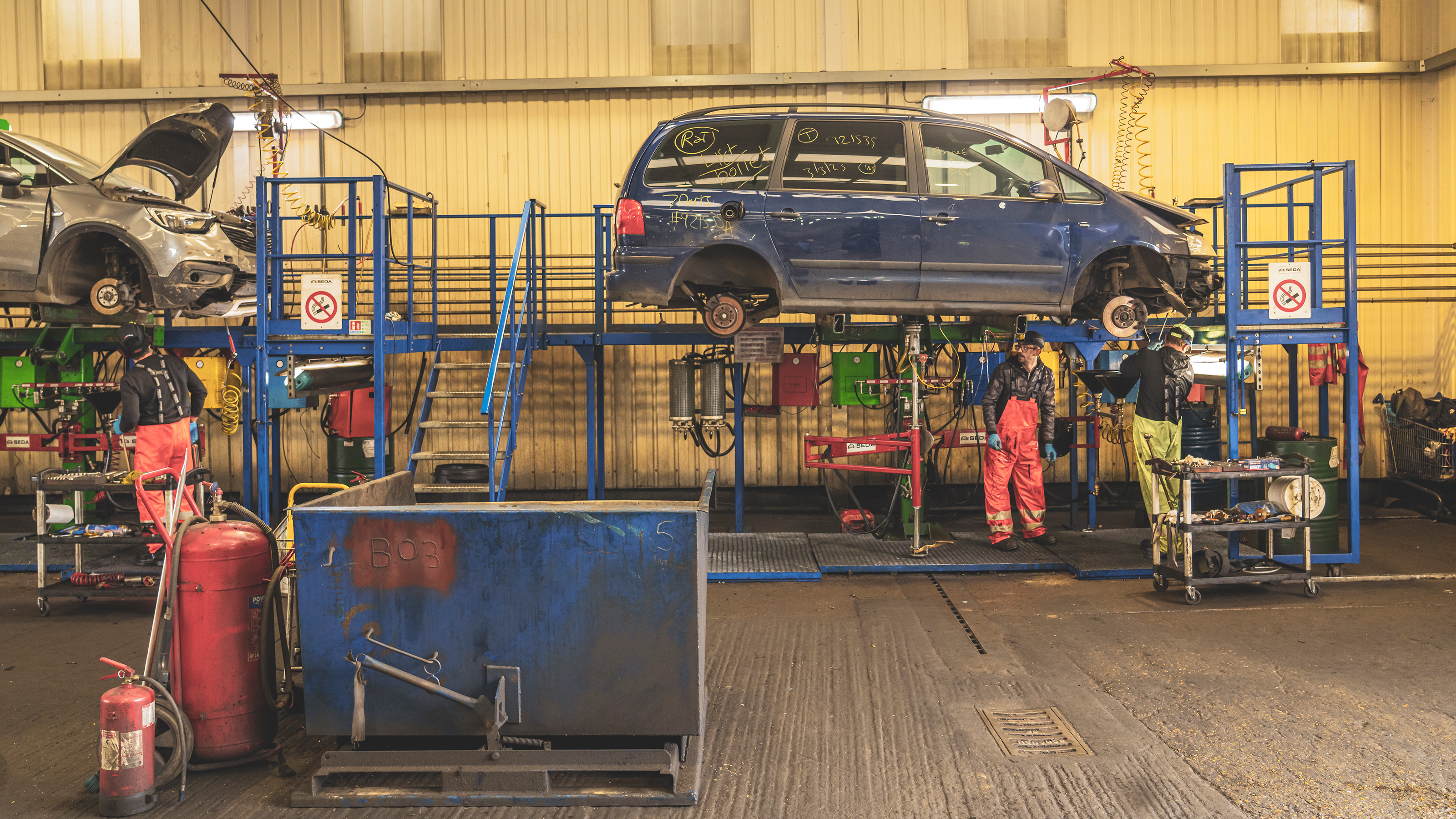 Recycled car parts - mechanical components being removed