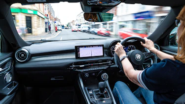 Auto Express pictures editor Dawn Grant driving the Alfa Romeo Tonale PHEV