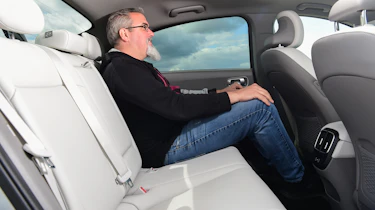 Auto Express senior test editor Dean Gibson sitting in back seat of Hyundai Ioniq 6