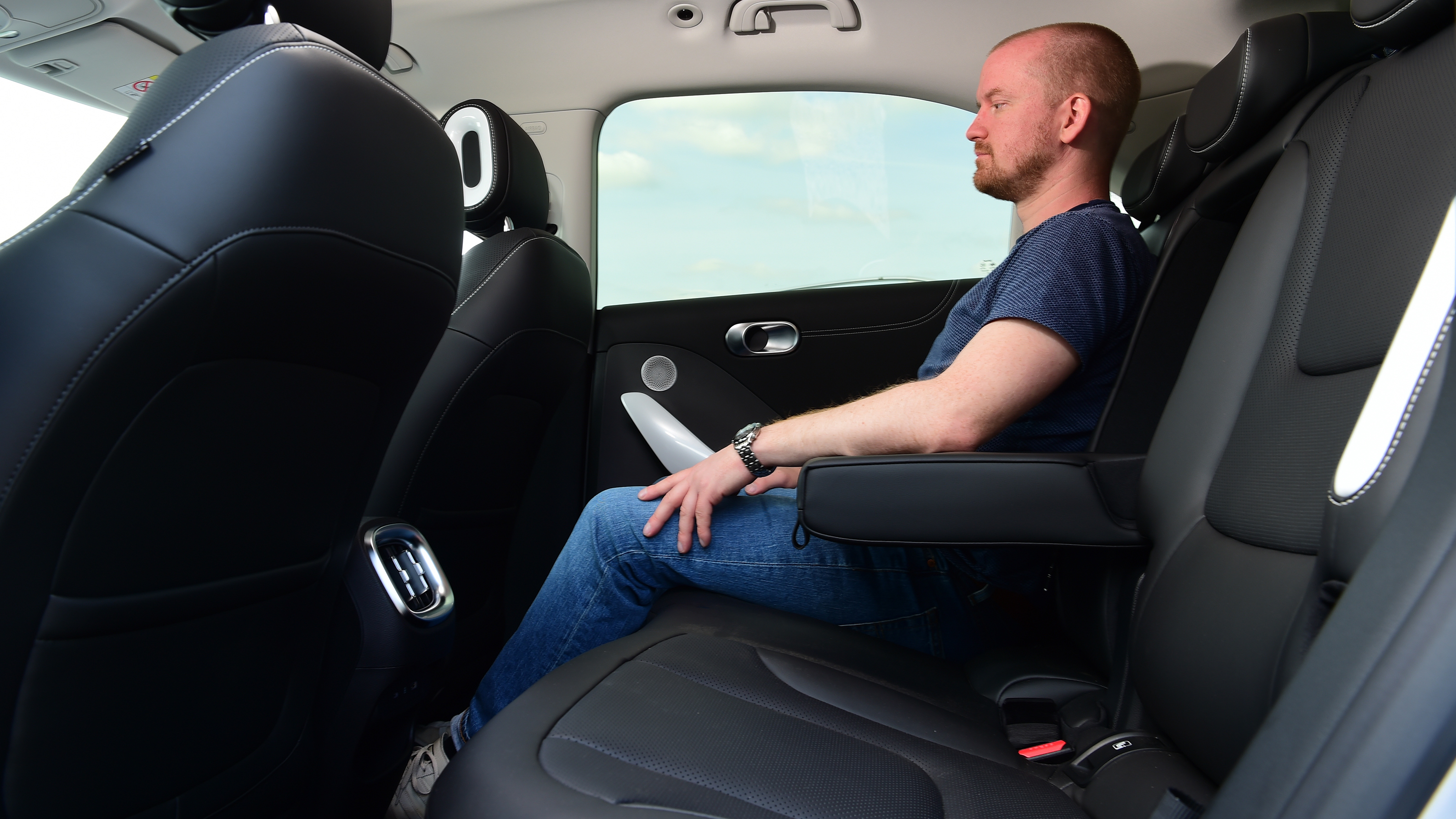 Auto Express chief reviewer Alex Ingram sitting in the back of the Smart #1