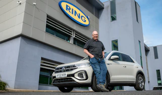Auto Express products editor Kim Adams leaning against our long-term Volkswagen T-Roc