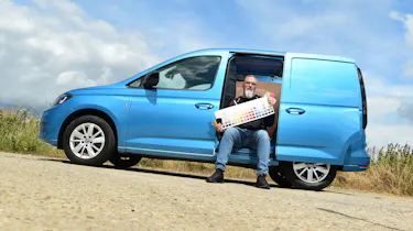 Auto Express senior test editor Dean Gibson sitting in the side of our long-term Volkswagen Caddy Cargo