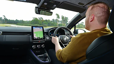 Auto Express news reporter Ellis Hyde driving the Renault Clio
