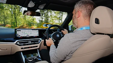Auto Express deputy editor Richard Ingram driving the BMW i4 eDrive35 M Sport