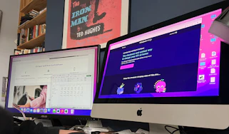 Person comparing tariff websites on two computer screens