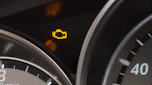Engine management light showing on a Mazda 6's dashboard
