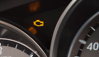 Engine management light showing on a Mazda 6's dashboard