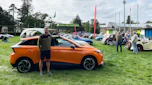 Auto Express deputy editor Richard Ingram standing with the MG4 Trophy Long Range at an MG event at Beaulieu