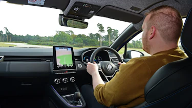 Auto Express news reporter Ellis Hyde driving the facelifted Renault Clio in the UK