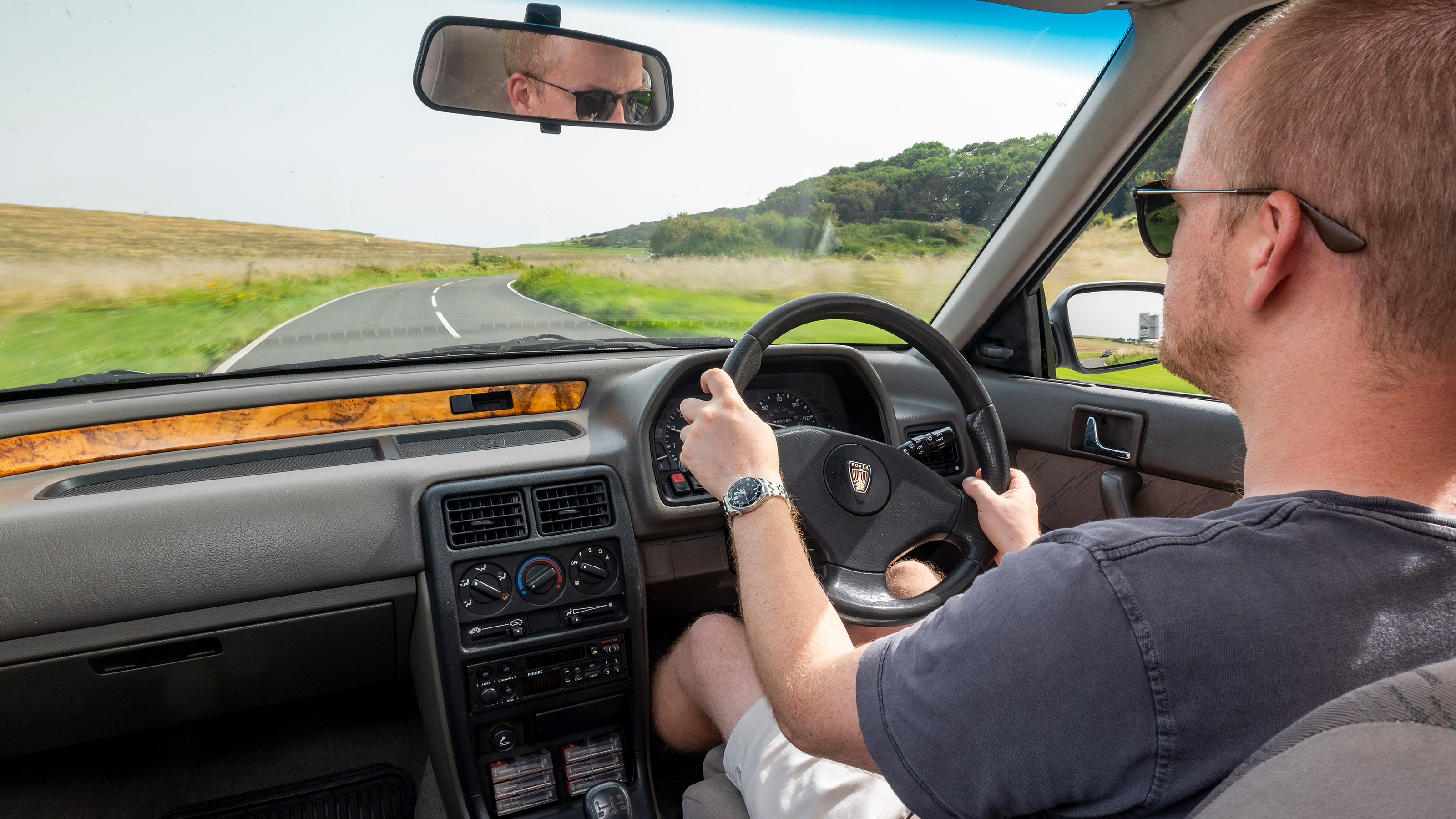 Auto Express chief reviewer Alex Ingram driving the Rover 214i