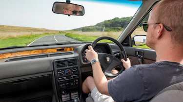Auto Express chief reviewer Alex Ingram driving the Rover 214i