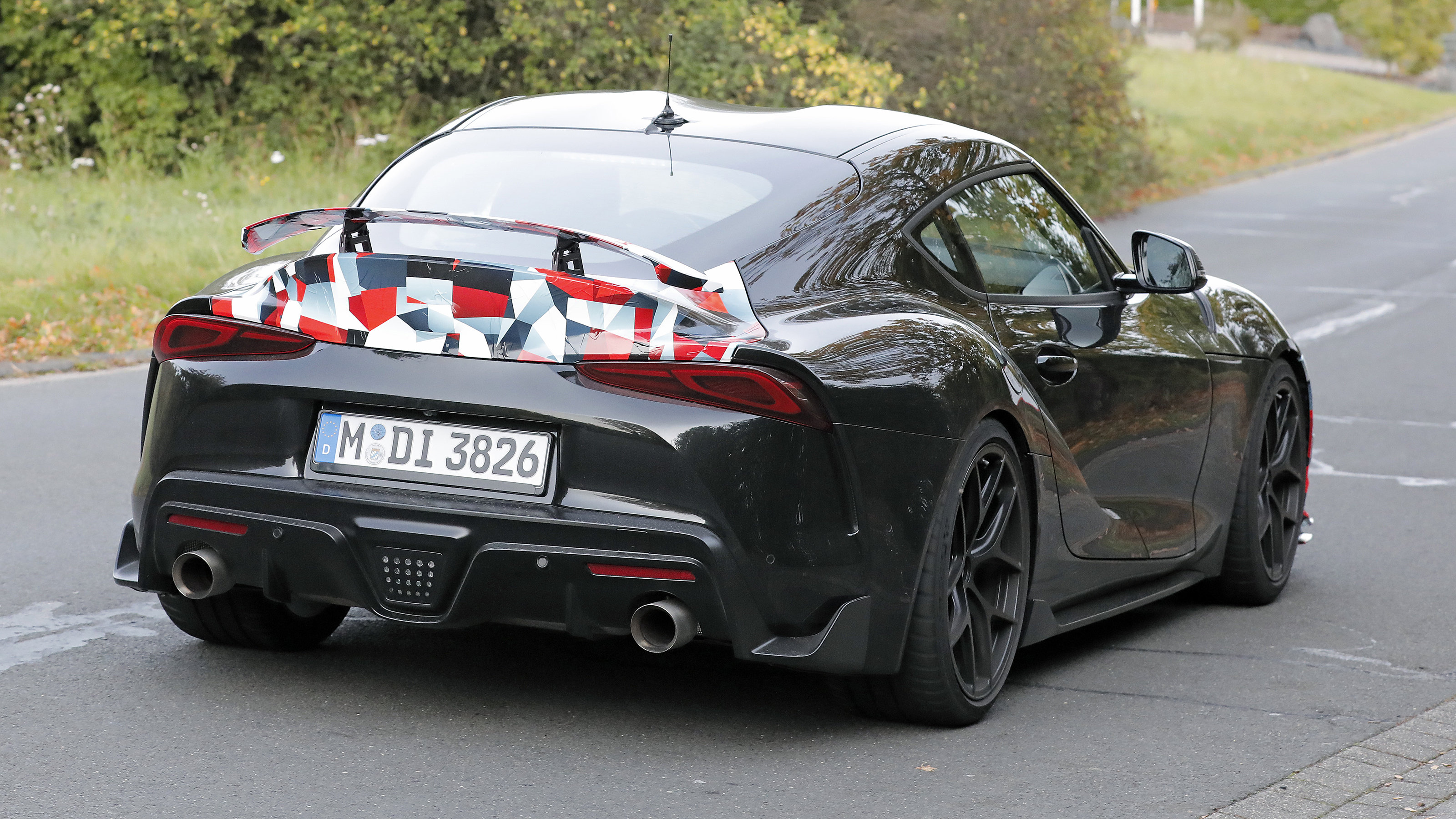 Toyota Supra GRMN (camouflaged) – rear 3/4 action