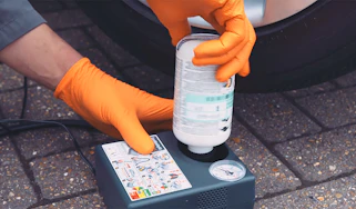 Person using a tyre puncture repair kit