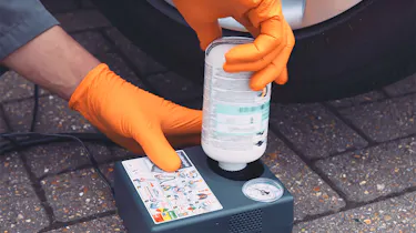 Person using a tyre puncture repair kit