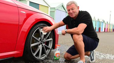 Auto Express special contributor Steve Sutcliffe cleaning the Audi TT's damaged wheel