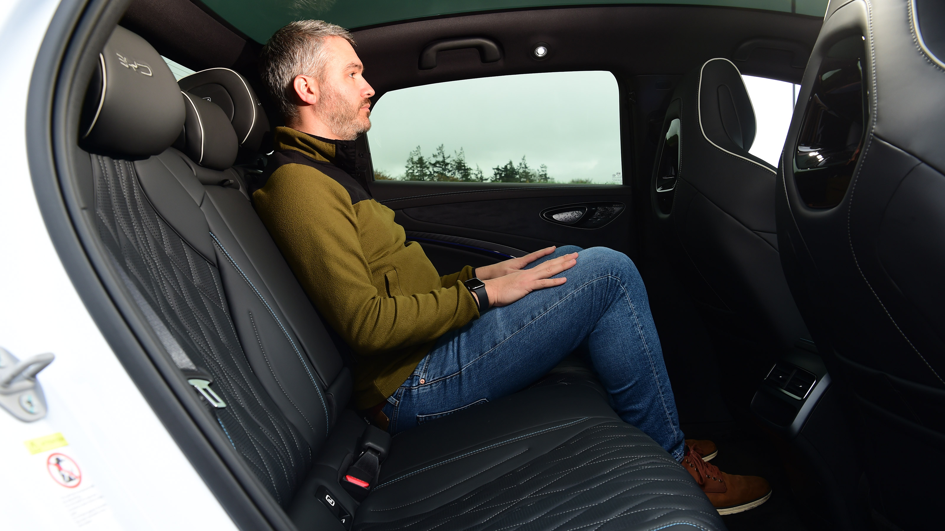 Richard Ingram sitting in the BYD Seal