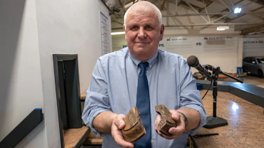Jim Ronan holding a broken gavel