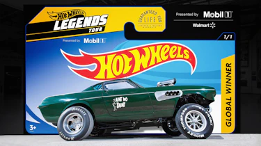 'Ain't no Saint' Volvo P1800 parked in front of Hot Wheels backdrop