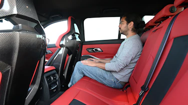 Audi RS 4 Avant vs BMW M3 Touring - BMW rear seats with Auto Express senior staff writer Jordan Katsianis
