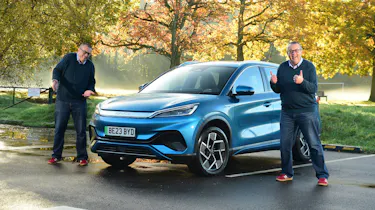 Duplicates of Auto Express editor-at-large John McIlroy standing next to the BYD Atto 3