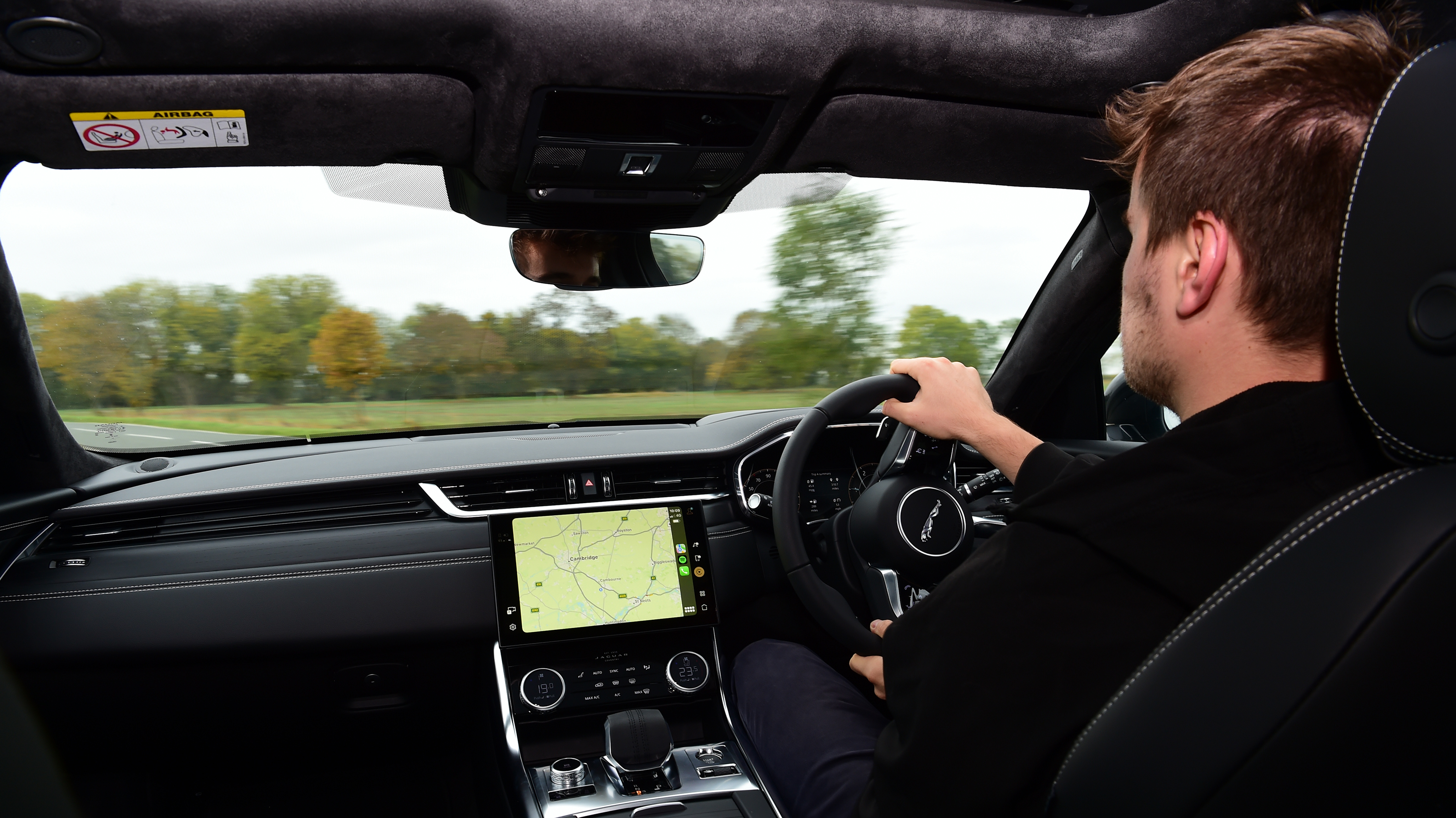Auto Express senior news reporter Alastair Crooks driving the Jaguar XF Sportbrake