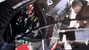 Ken Block sitting in the Audi S1 e-tron quattro Hoonitron