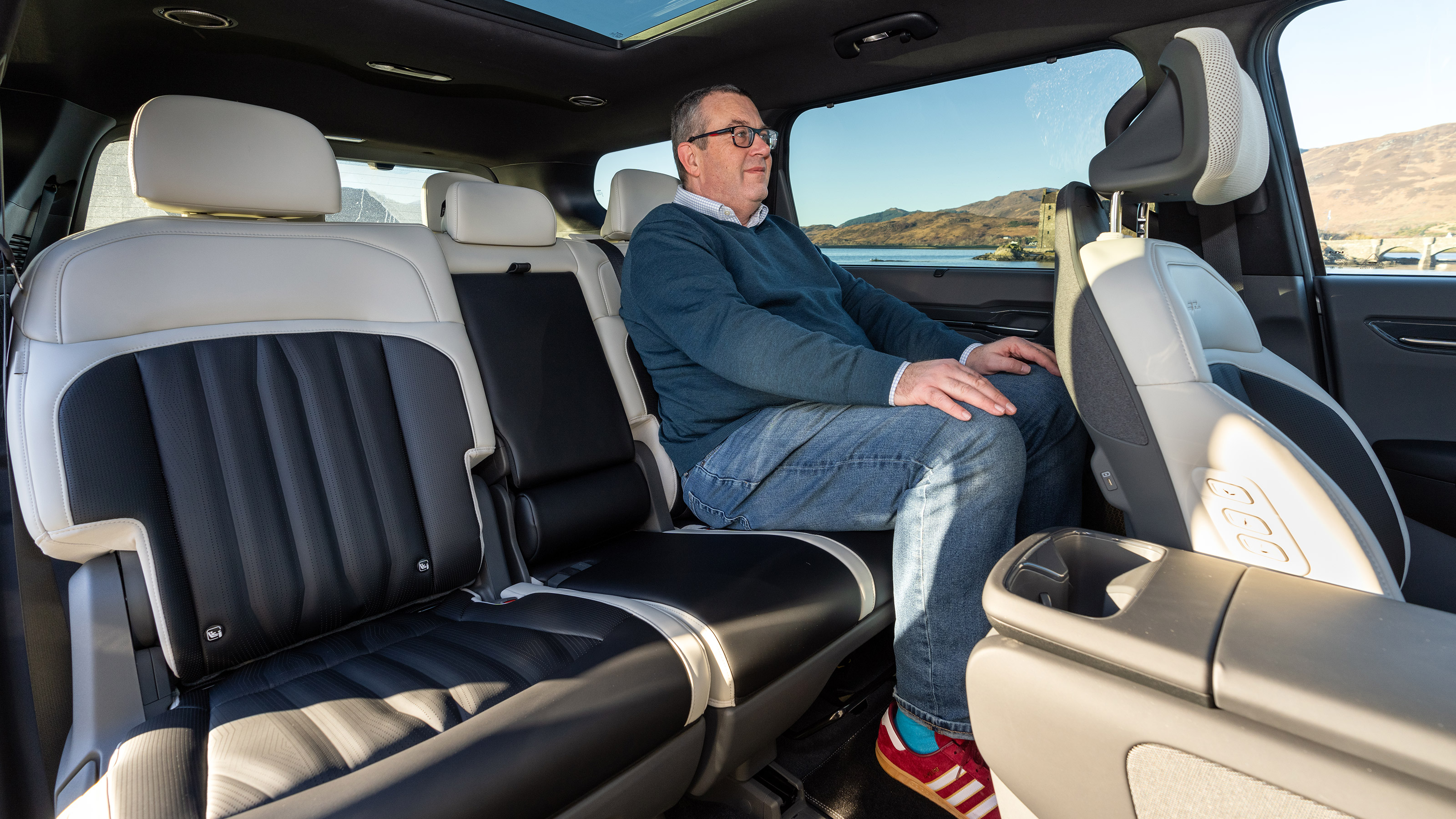 John McIlroy sitting in the Kia EV9