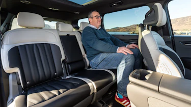 John McIlroy sitting in the Kia EV9