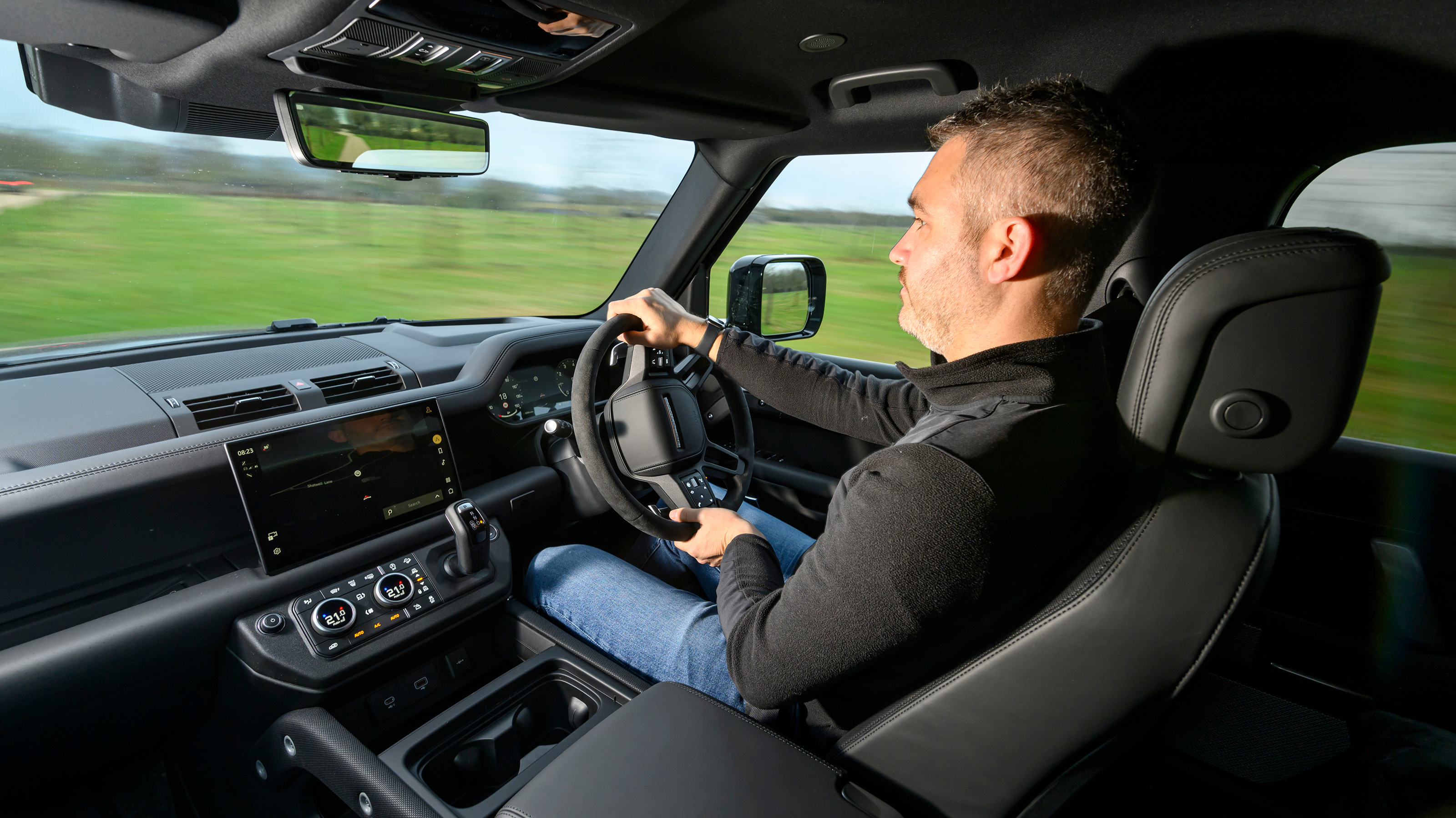 Auto Express deputy editor Richard Ingram driving the Land Rover Defender 130 P500 AWD