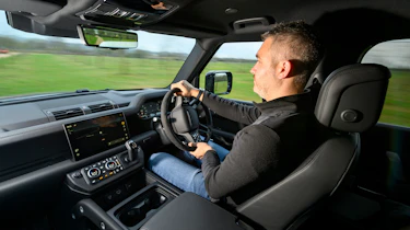 Auto Express deputy editor Richard Ingram driving the Land Rover Defender 130 P500 AWD
