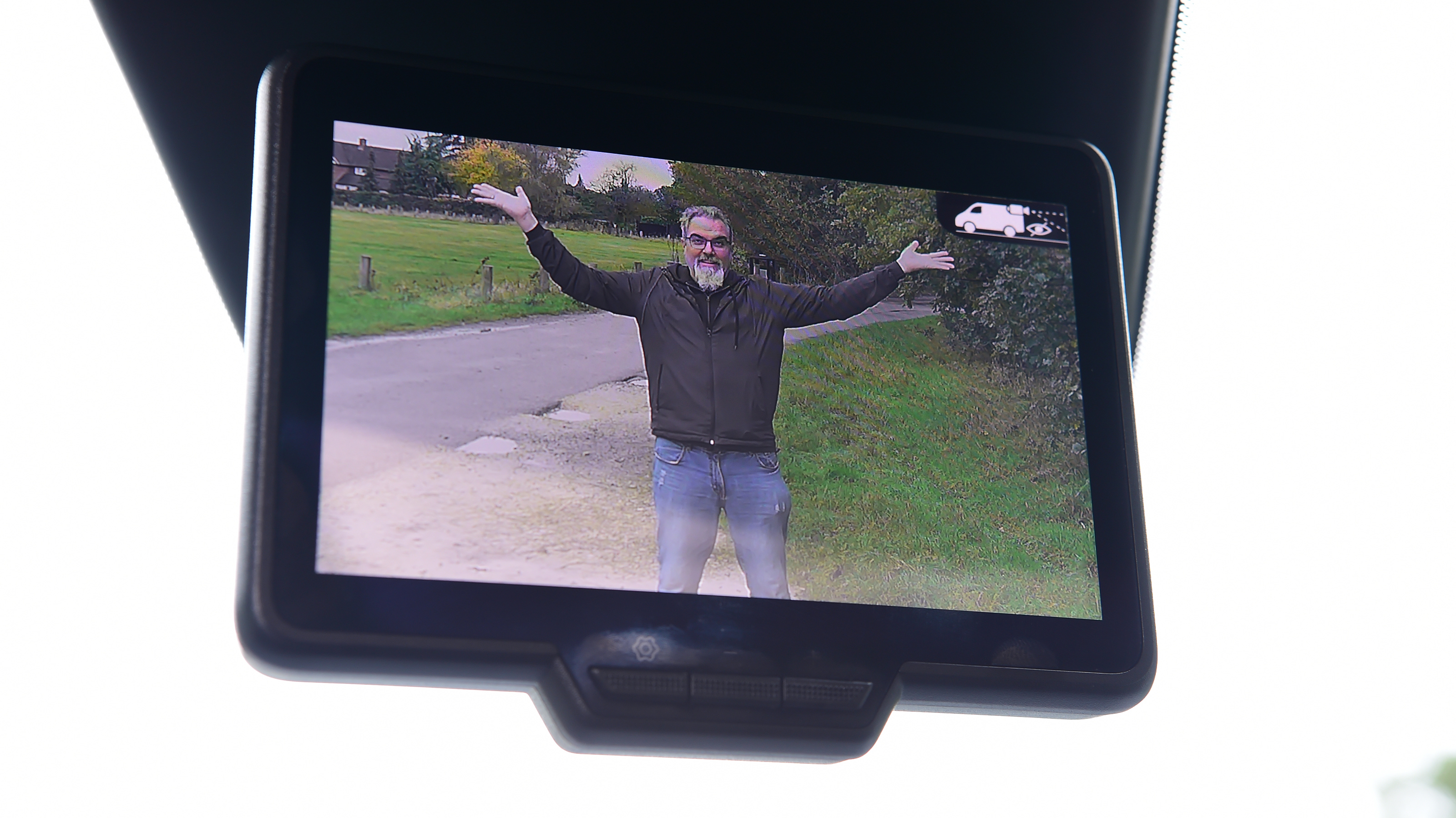 Auto Express senior test editor Dean Gibson posing on our long-term Renault Kangoo E-Tech's dash cam screen