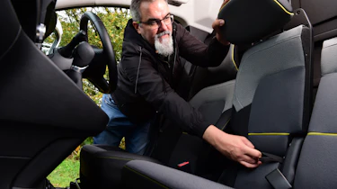 Auto Express senior test editor Dean Gibson folding our long-term Renault Kangoo E-Tech's middle seat