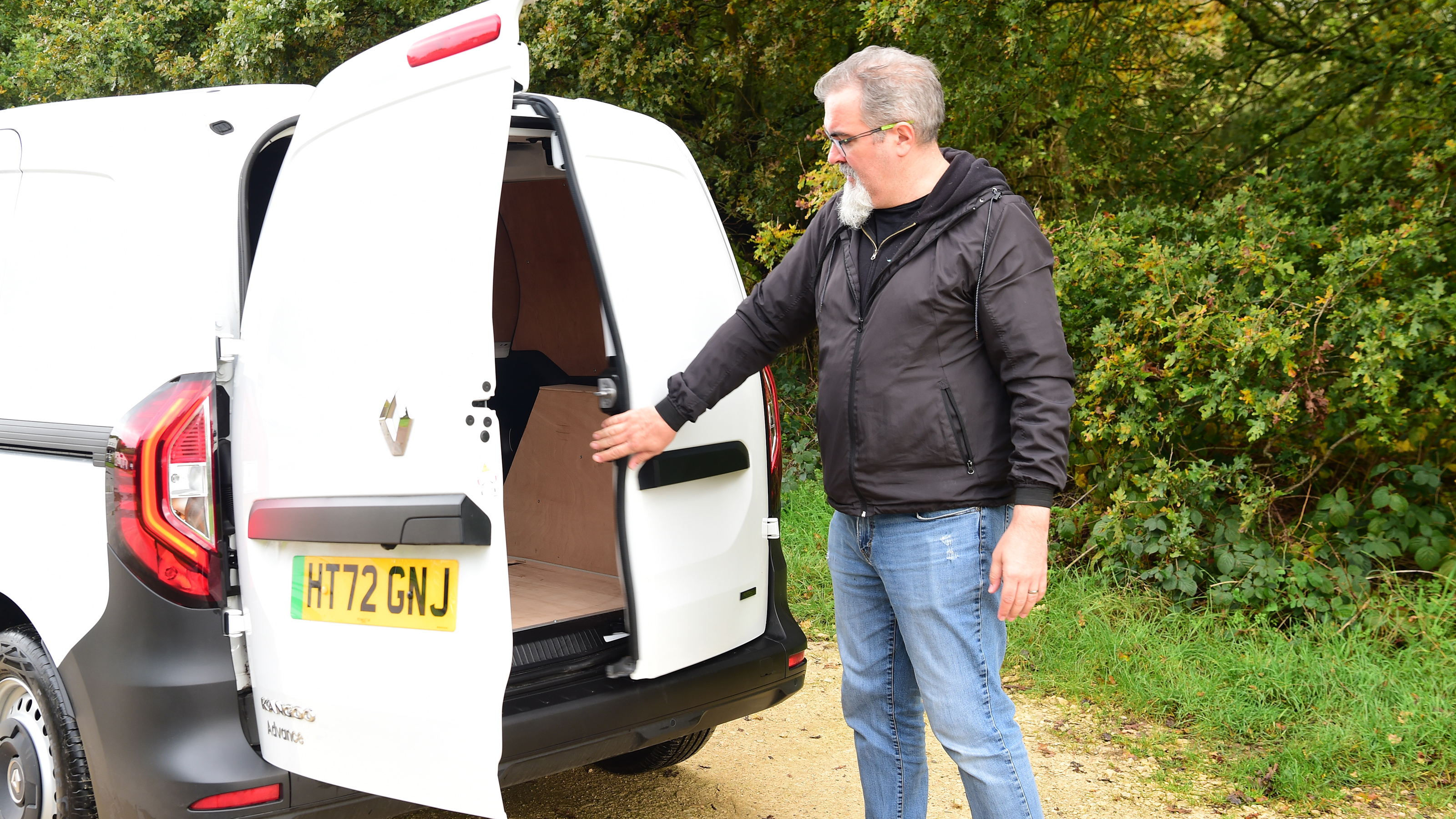 Auto Express senior test editor Dean Gibson inspecting our long-term Renault Kangoo E-Tech's cargo bay