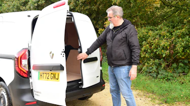 Auto Express senior test editor Dean Gibson inspecting our long-term Renault Kangoo E-Tech's cargo bay