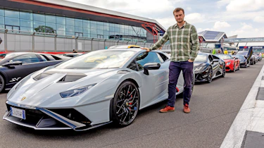 Auto Express senior news reporter Alastair Crooks standing with a Lamborghini Huracan