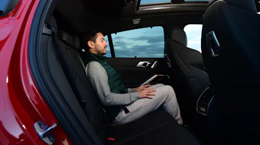 BMW X6 M Competition - rear seats with Auto Express senior staff writer Jordan Katsianis.