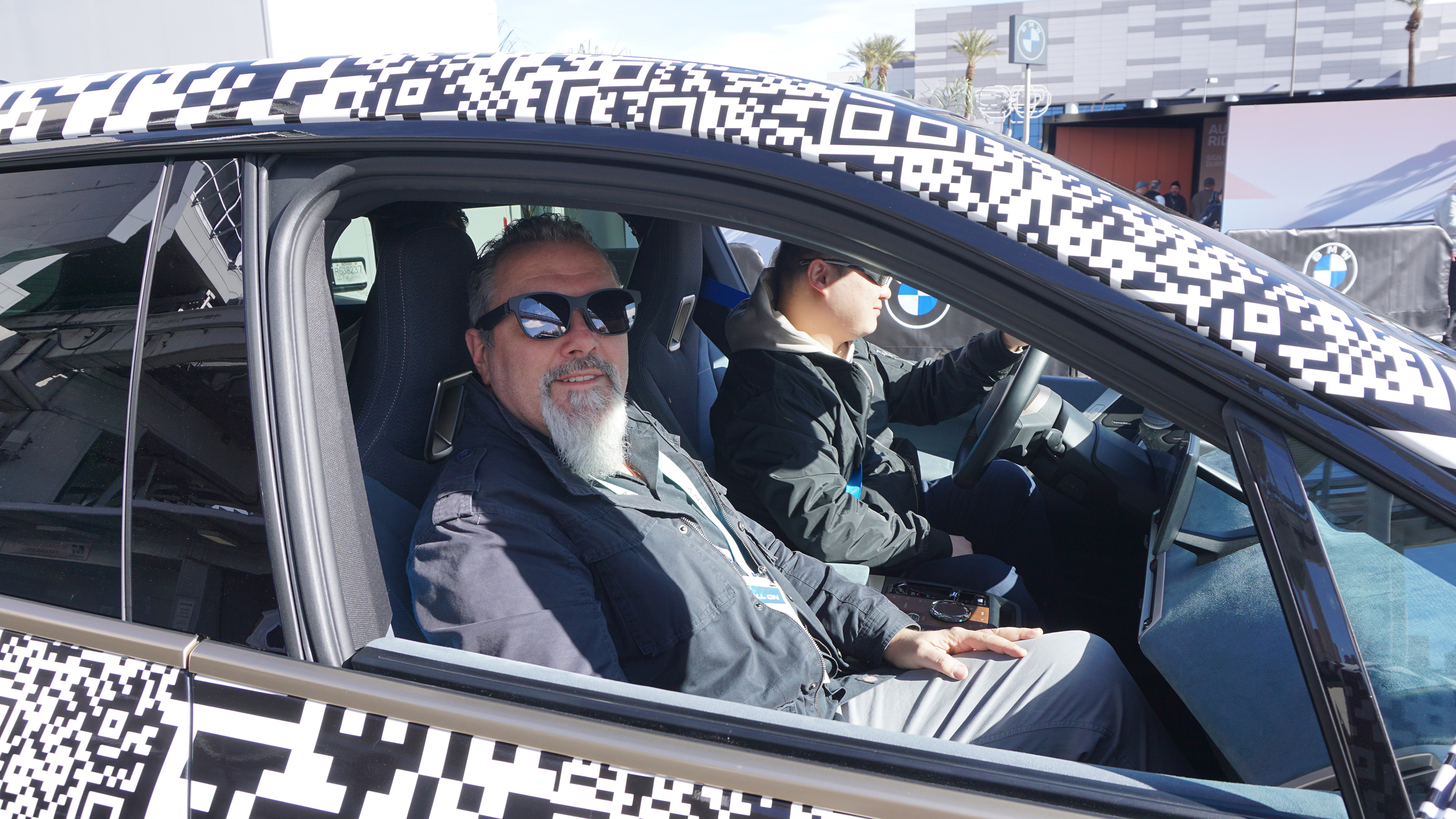 Auto Express senior test editor Dean Gibson sitting in the BMW iX