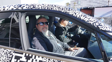 Auto Express senior test editor Dean Gibson sitting in the BMW iX